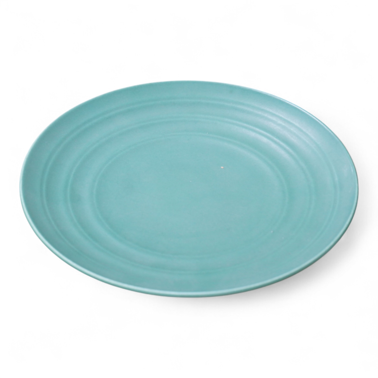 Keith Murray for Wedgwood, a green glazed ribbed tazza or footed dish, 23cm in diameter